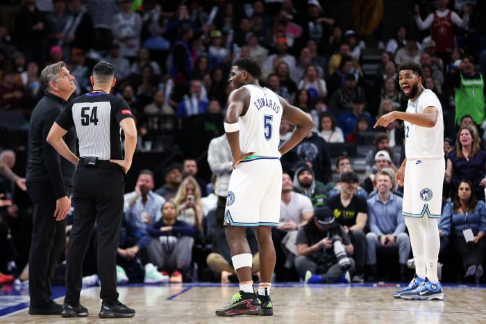 Feb 23, 2024; Minneapolis, Minnesota, USA; Minnesota Timberwolves center Karl-Anthony Towns (32) argues after he was charged with a foul against the Milwaukee Bucks during the second half at Target Center. Mandatory Credit: Matt Krohn-USA TODAY Sports